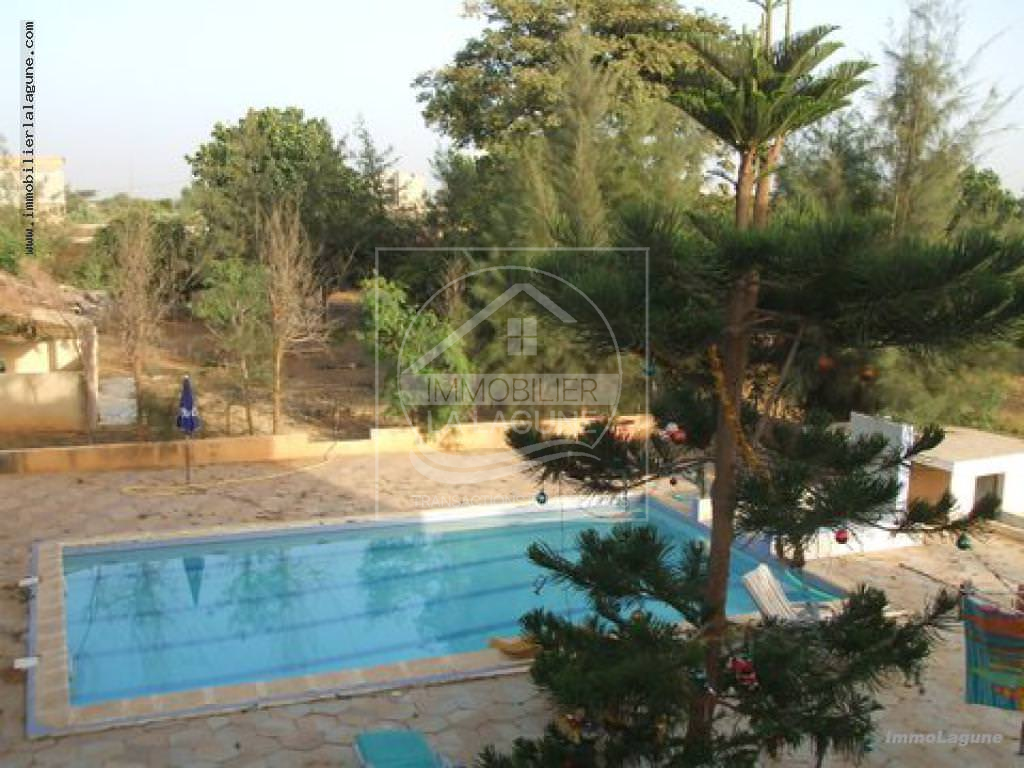 Agence Immobilière Saly Sénégal - T2129 - Terrain à NGAPAROU - V2129 grande Villas avec piscine en vente à Ngaparou Sénégal